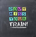 DonÃ¢â¬â¢t miss your train text on colorful post-it notes stuck on blackboard Royalty Free Stock Photo